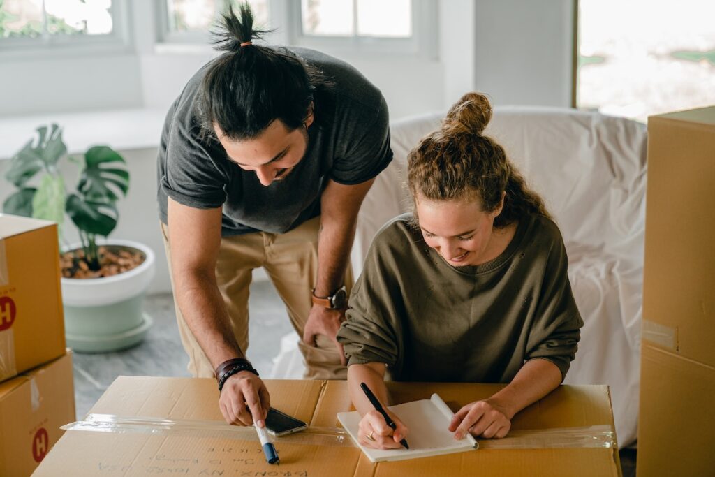 couples preparing checklist for home relocation service